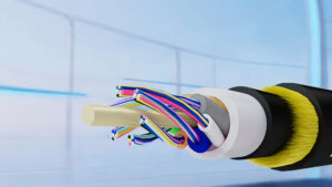 "Cross-section of a fiber optic cable showing multiple colored optical fibers, protective layers, and yellow strength fibers